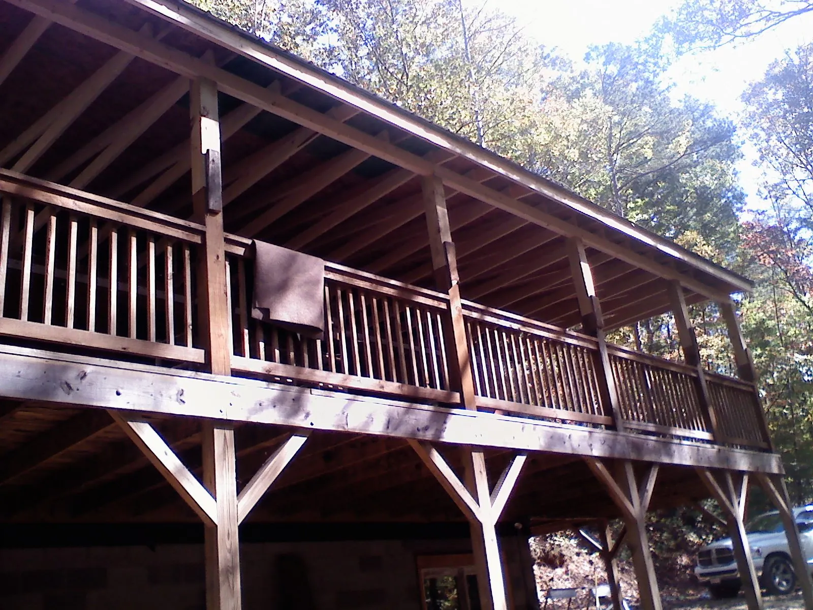 Timber framing under a new elevated porch and deck — Roof Leak Repair in Waterville by Roofing Brothers